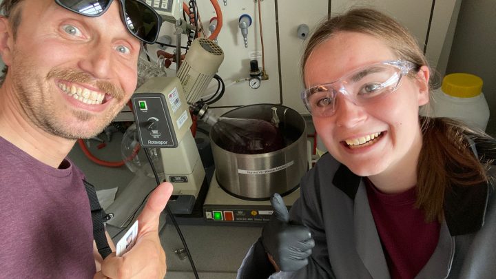 Julia and her supervisor, Mirko, pose with the rotary evaporator.