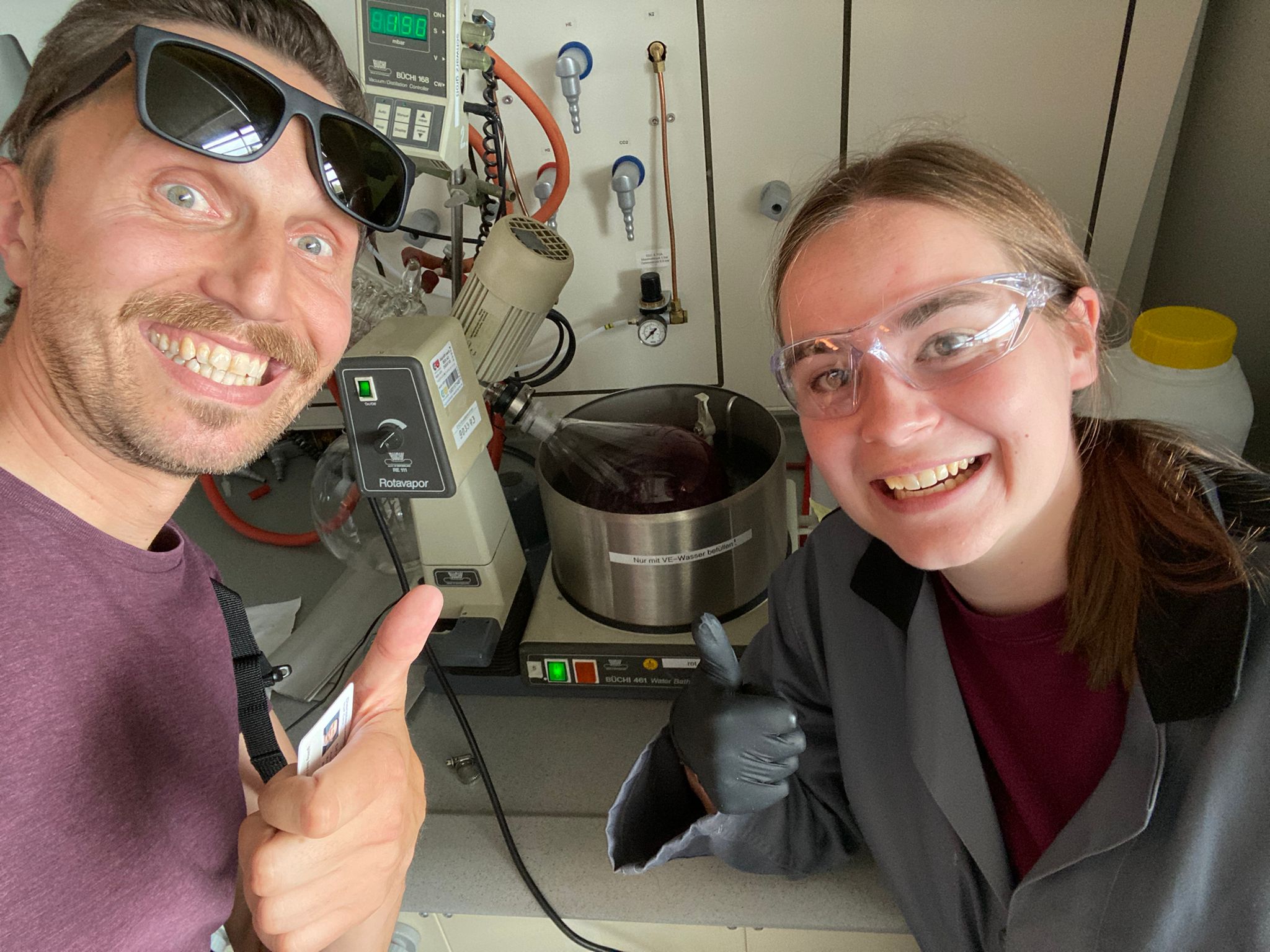 Julia and her supervisor, Mirko, pose with the rotary evaporator.